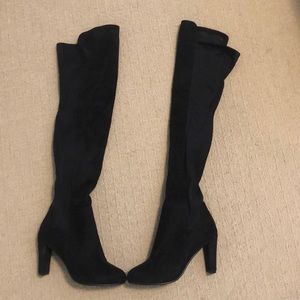 Over the knee black boots.